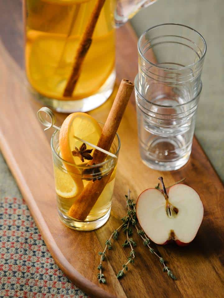 Spicy apple juice cocktail with cinnamon, cloves and anise